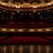 Empty theatre auditorium with stage lighting, UK